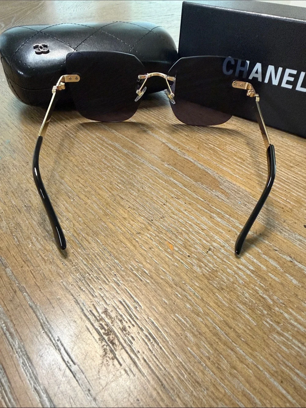 CHANEL Rimless Square Sunglasses with Dark Gradient Lenses and Gold Accents